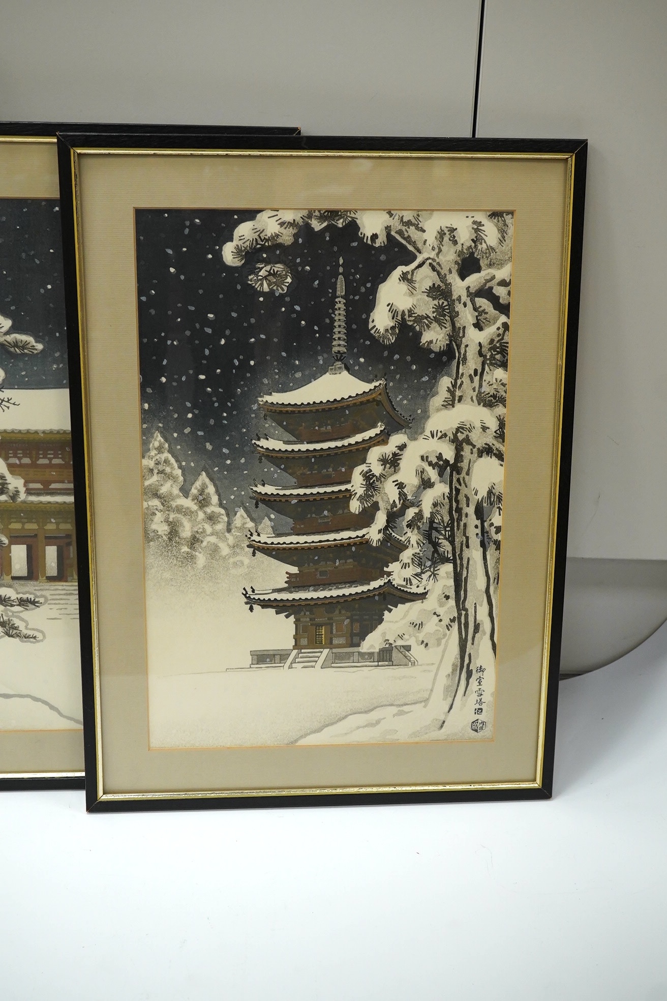 Nisaburo Ito (1905-2001), two pairs of Japanese woodblock prints, Pagodas, signed with character marks, largest each 39 x 26cm. Condition - fair to good, some minor discolouration